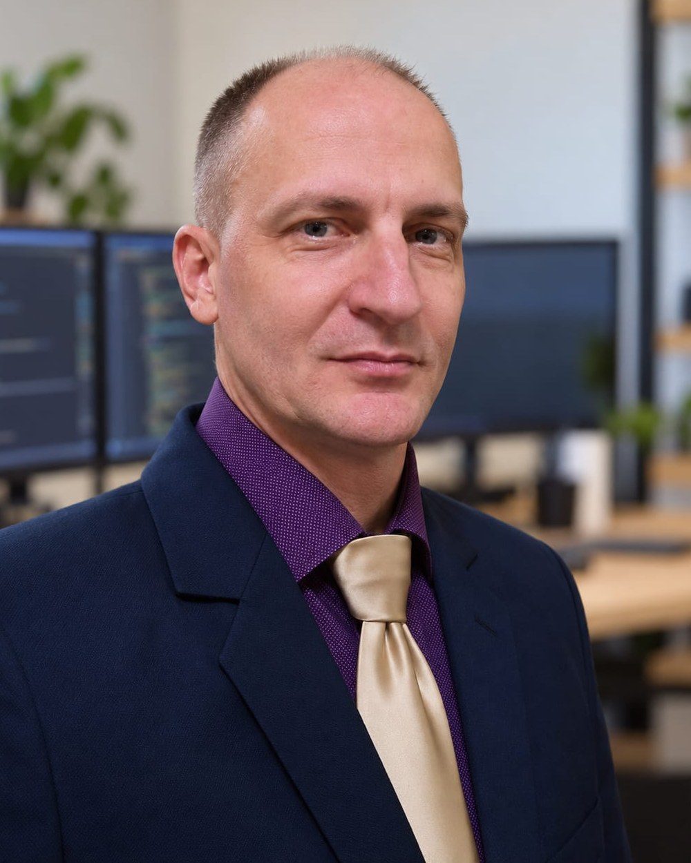 Mihály Madár in a suit, office portrait